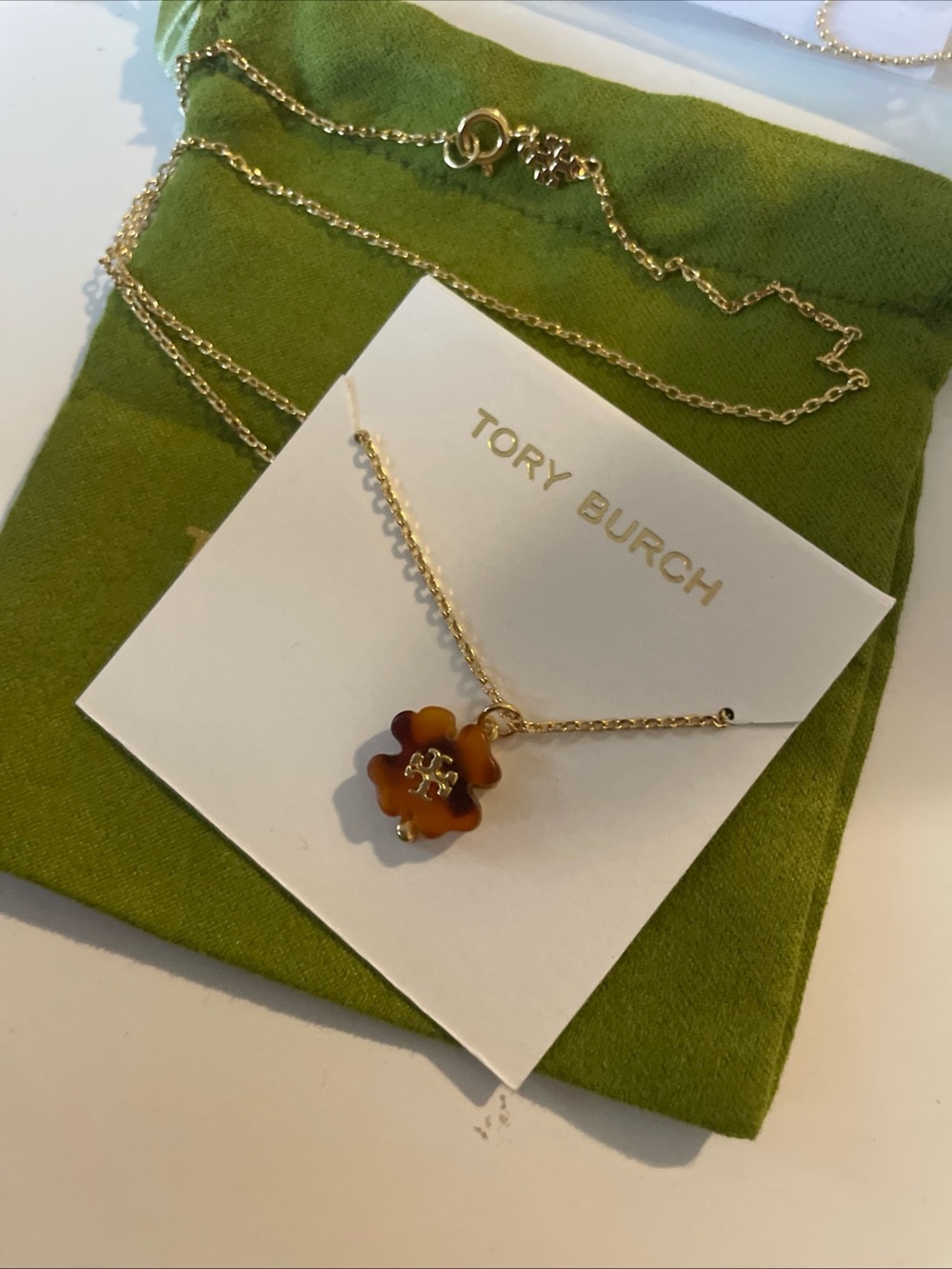 Tory Burch Gold Necklace with Brown Tortoiseshell Flower Charm